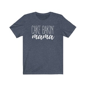May include: A dark blue t-shirt with the text "CAKE BAKIN' mama" in white.