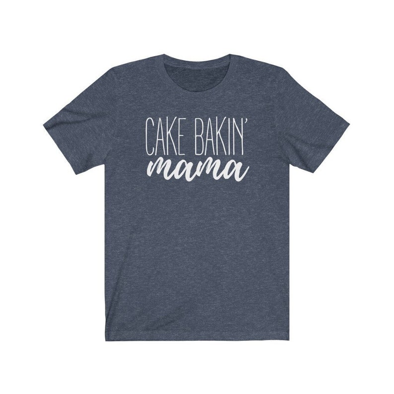 May include: A dark blue t-shirt with the text "CAKE BAKIN' mama" in white.