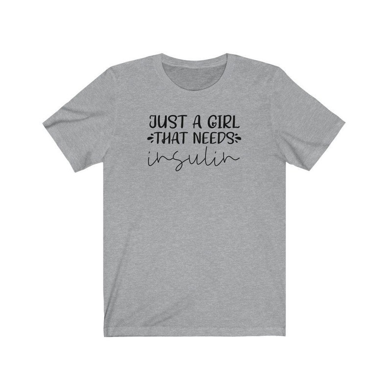 May include: Gray short-sleeved t-shirt with the text "Just a girl that needs insulin" in black.