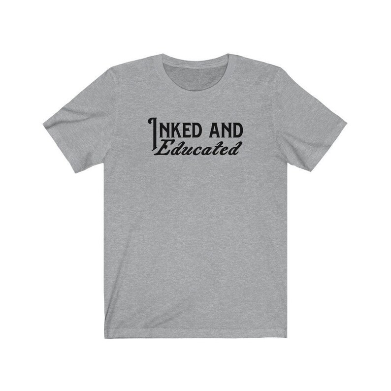 May include: A heather grey t-shirt with the text "INKED AND Educated" printed in black.