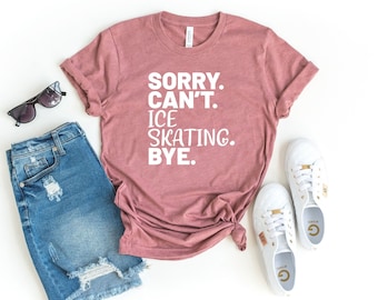 May include: A mauve t-shirt with the text "SORRY. CAN'T. ICE SKATING. BYE." printed in white.