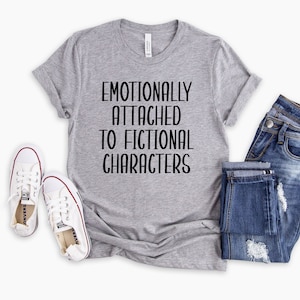 May include: A gray t-shirt with the text "Emotionally Attached to Fictional Characters" printed in black.