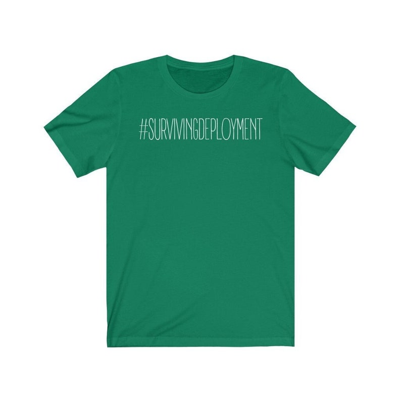 May include: A green short-sleeved t-shirt with the text "#SURVIVINGDEPLOYMENT" printed in white on the front.