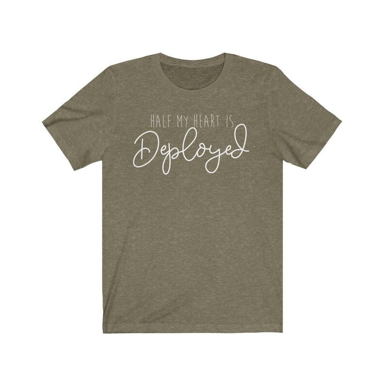 May include: A green t-shirt with the text "Half my heart is Deployed" in white.