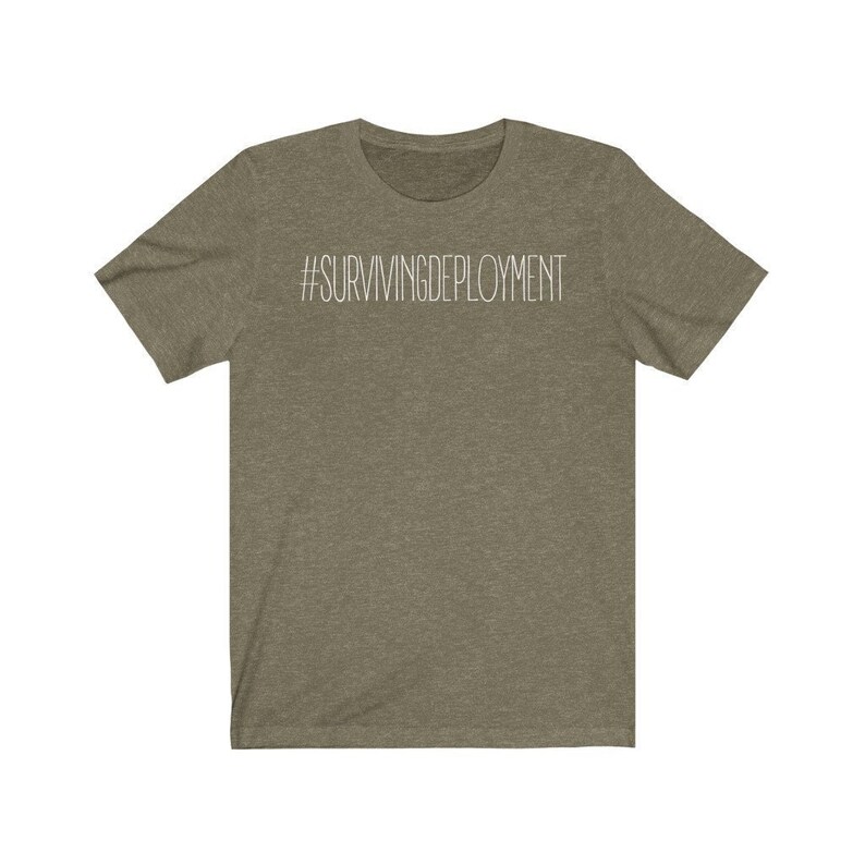 May include: A green t-shirt with the text "#SURVIVINGDEPLOYMENT" printed in white on the front.