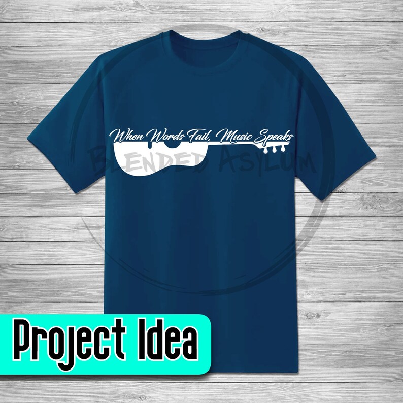 May include: A dark blue t-shirt with a white outline of a guitar and the text "When Words Fail, Music Speaks".