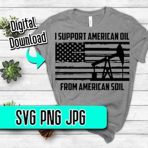 May include: A gray t-shirt with a black and white distressed American flag design. The flag has an oil derrick in the center. The text "I Support American Oil From American Soil" is printed on the shirt.