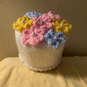 Knit Toilet Roll Cover Pastel Flowers on White Base  Toilet Paper Roll Cozy Yellow Blue Pink Green