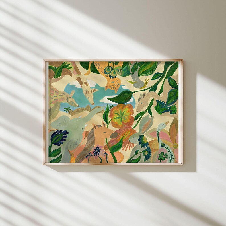 May include: A rectangular framed art print featuring a colorful illustration of various animals including a giraffe, elephant, horse, and rabbit nestled among green foliage, large orange flowers, and blue sky elements on a light beige background.