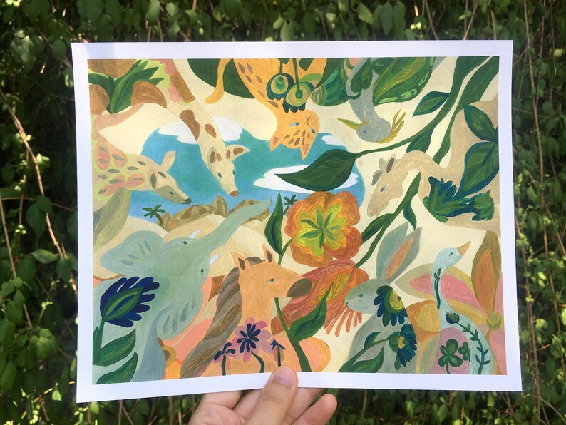 May include: A rectangular art print featuring a vibrant, multi-colored illustration of various animals including a giraffe, elephant, horse, and rabbit surrounded by stylized flowers and foliage against a light cream background with a blue sky.