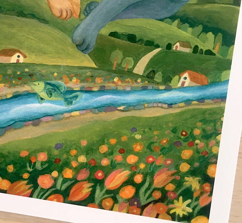 May include: A painting depicting a landscape with a blue river flowing through green hills, small houses, and a field of orange, yellow, and red flowers. A green fish leaps from the water, while a blue creature's paw reaches down from above.