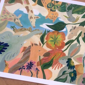 May include: A colorful art print featuring a whimsical collection of animals including a giraffe, elephant, horse, rabbit, and bird amidst large orange and green flowers. The composition uses a palette of soft blues, pinks, and earthy tones.