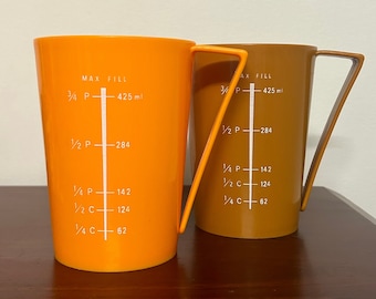 Vintage Measuring & Mixing Cup Set of Two Cups - Yellow Mustard Brown - Retro Plastic Baking Kitchen Ware - Funky Arm Design 60's 70's