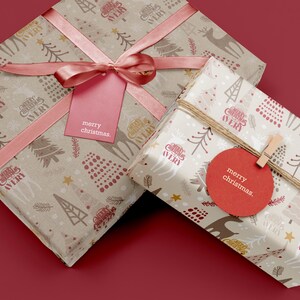 May include: Two gift boxes wrapped in brown paper with a white and red pattern. The boxes are tied with pink ribbon and have a red tag with the text "merry christmas." on them.