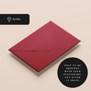 May include: A burgundy envelope with a flap. The text "ONLY TO BE ORDERED WITH YOUR STATIONERY. NOT AFTER IT SHIPS" is printed in white on a black circle.