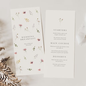 May include: Wedding breakfast menu with floral illustrations. The menu includes starters, main course, and desserts. The text reads "Wedding Breakfast", "Daisy & Edward", "20.09.2000", "Starters", "Smoked chicken, apricot and arugula with pine nuts", "Pea and mint soup served with a selection of breads", "Main Course", "Mushroom ravioli with chestnut cream and truffle oil", "Stewed black pork cheek and loin with potato au gratin and vegetables", "Desserts", "Dark chocolate mousse, olive oil and salt flowers", "Chocolate and caramel pie with vanilla ice cream".
