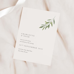 May include: A wedding invitation with a simple design featuring a green olive branch illustration. The invitation reads "CHARLOTTE & NOAH invite you to the ceremony and celebration of their marriage 20TH SEPTEMBER 2030 at the Venue Name, Road Name, Town Name, Postcode."