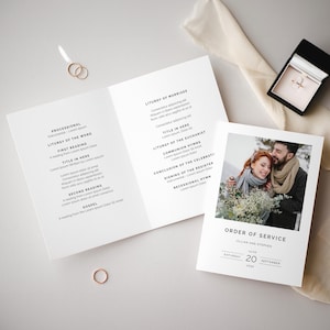 May include: A wedding ceremony order of service with a photo of the couple on the front. The order of service includes the processional, liturgy of the word, liturgy of marriage, liturgy of the Eucharist, communion hymns, conclusion of the celebration, signing of the register, and recessional hymn. The date of the wedding is Saturday, 20 September 2020.