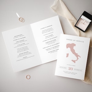 May include: A wedding ceremony order of service with a pink outline of Italy. The text reads "Lucinda & Jeremy" and "20 September 2020".
