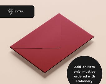 May include: A deep red envelope with a triangular flap, positioned at an angle. A black rectangular label in the top left corner displays a diamond icon and the word EXTRA. A black circular label in the bottom right corner contains the text: Add-on item only; must be ordered with stationery.