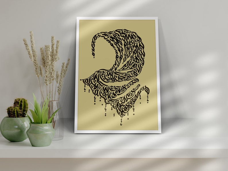 May include: A framed print with a black and white calligraphic design on a light yellow background. The design is a flowing, abstract shape with intricate details.