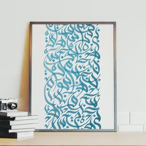 May include: A framed print with a vertical design of blue Arabic calligraphy on a white background.