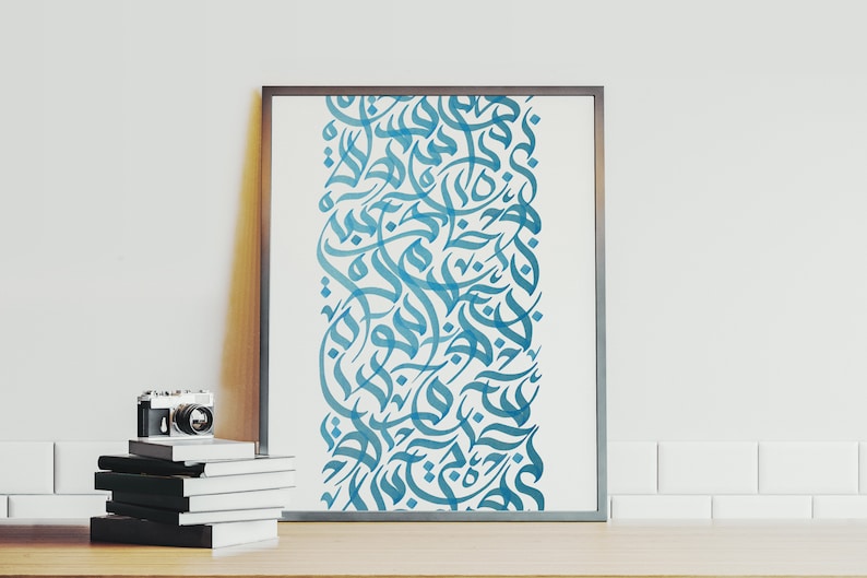 May include: A framed print with a vertical design of blue Arabic calligraphy on a white background.