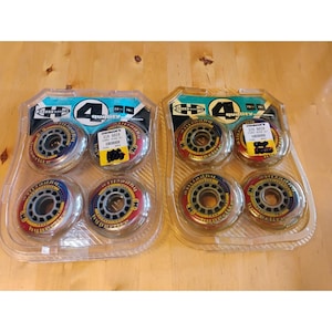 May include: Two sealed plastic blister packs, each containing four Hyper Wheels brand inline skate wheels. The wheels are red and grey with 72mm and 78A specifications printed on the packaging. Each pack features a large number 4 graphic.