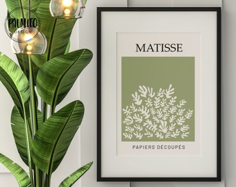 May include: A framed print of a Matisse artwork featuring a green background with white cut-out paper shapes. The title "MATISSE" and the text "PAPIERS DÉCOUPÉS" are printed below the artwork.