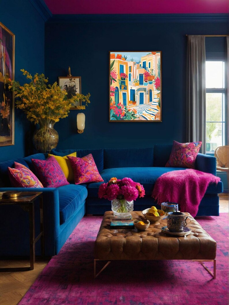 May include: A blue velvet sectional sofa with pink throw pillows and a pink throw blanket. The sofa is in a living room with a brown leather ottoman, a vase of pink flowers, and a painting of a colorful cityscape.