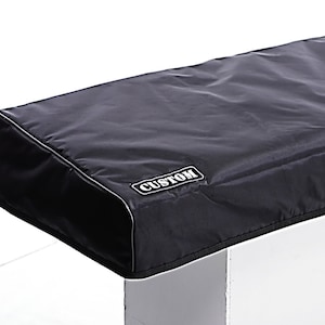 May include: Black keyboard cover with a white "CUSTOM" label. The cover is made of a soft, durable material and is designed to protect your keyboard from dust, dirt, and spills.