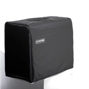 May include: Black amp cover with the word "CUSTOM" printed on the front.