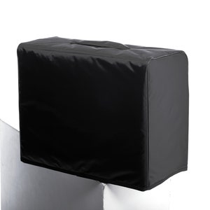 May include: Black amp cover with a carrying handle.