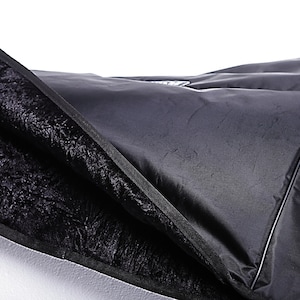 May include: Black padded case with a zipper closure and a soft black lining. The case is made of a durable material and is designed to protect your equipment.