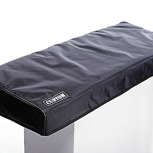 May include: Black keyboard cover with a white "CUSTOM" label.