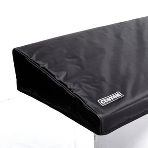 May include: Black keyboard cover with a "CUSTOM" label.