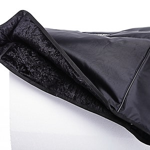 May include: Black padded keyboard case with a soft, fuzzy lining. The case is folded open to show the lining.