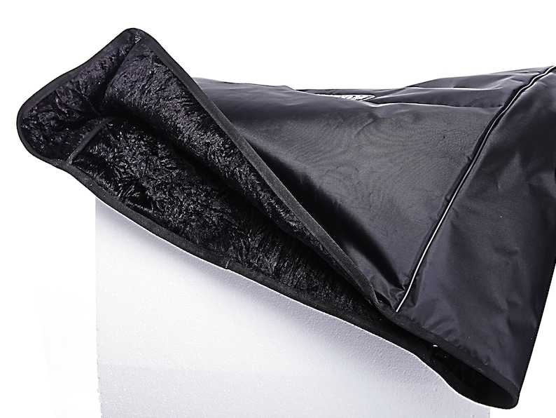 May include: Black padded keyboard case with a soft, fuzzy lining. The case is folded open to show the lining.