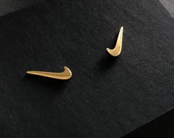 nike gold studs
