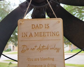 Dad is in a meeting, please do not disturb sign.