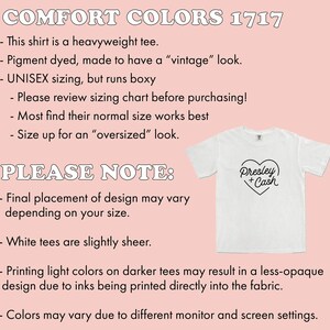 K&ouml;nnte beinhalten: Wei&szlig;es Unisex-T-Shirt mit einem schwarzen Herz-Design, auf dem "Presley + Cash" steht. Das Shirt ist ein schweres T-Shirt, das mit Pigmenten gef&auml;rbt wurde, um einen Vintage-Look zu erzielen. Der Text auf dem Bild lautet "COMFORT COLORS 1717" und enth&auml;lt Gr&ouml;&szlig;eninformationen.