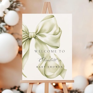 Cartello di benvenuto per baby shower con fiocco verde salvia moderno, modello per cartello d'ingresso per baby shower con fiocco verde salvia, minimalista, 18x24 e 24x36, Canva