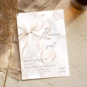 May include: A baby shower invitation with a watercolor illustration of a white bow and the text "Heaven sent". The invitation includes the name Elisabeth Wilson, the date and time of the shower, and the address and RSVP information.