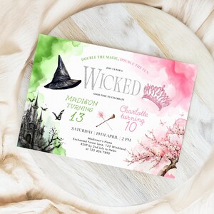 May include: A green and pink invitation with a witch's hat and a crown. The text reads "Double the magic, double the fun. Join us for a Wicked good time to celebrate. Madison turning 13. Charlotte turning 10. Saturday 19th April, 2 PM. Madinson's Home, Enchanted Forest Lane, 123 Witchland. RSVP by 2nd July to Helen at 123 456 7890."