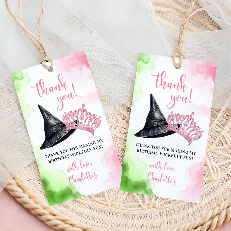 May include: Two pink and green thank you tags with a witch's hat and a princess crown. The text reads "Thank you!" and "Thank you for making my birthday wickedly fun! With love, Charlotte's".