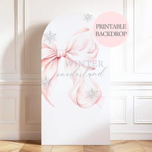 May include: A white printable backdrop with a large pink bow and silver snowflakes. The words "Winter" and "Wonderland" are written in silver script. A pink circle with the words "Printable Backdrop" is in the upper right corner.