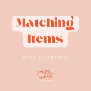 May include: A pink background with a white rounded rectangle containing the text "Matching Items" in orange. Below the rectangle is the text "SOLD SEPARATELY" in white. At the bottom of the image is a logo in orange that says "freya events" with the text "PAPERIE & DECOR" below it.