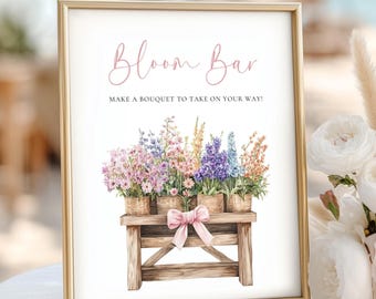May include: A framed sign with the text "Bloom Bar" in pink script. Below, the sign reads "Make a bouquet to take on your way!" Watercolour illustration of flowers in baskets on a wooden stand with a pink bow.