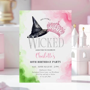 May include: A pink and green watercolor invitation with a black witch's hat and a pink crown. The text reads "Join us for a Wicked Good Time to Celebrate Charlotte's 10th Birthday Party". The invitation includes the date, time, location, and RSVP information.
