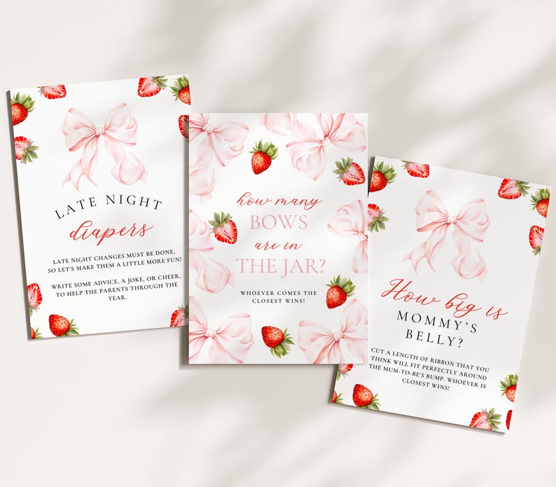 May include: Three white cards with pink bows and strawberries, designed for a baby shower. The cards have text: "Late Night Diapers", "How many bows are in the jar?", and "How big is Mommy's belly?" The cards are decorated with watercolor illustrations.